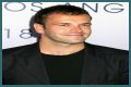 Jonny Lee Miller flashes ink for Ellen charity